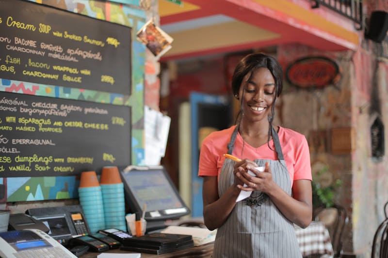 Friendly and smiling Dion's staff member ready to serve